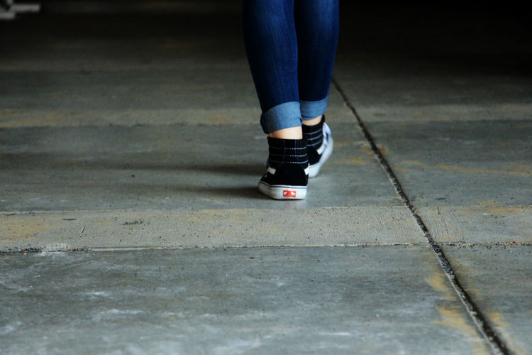 Low section of person on road