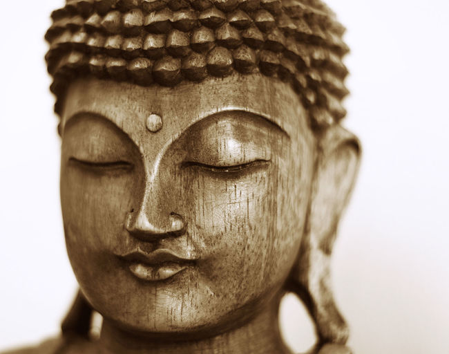 Close-up of statue against white background