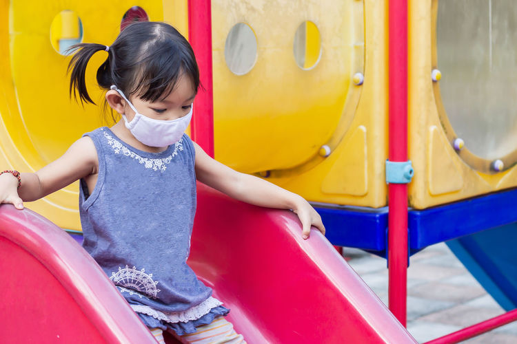 Full length of cute girl in playground