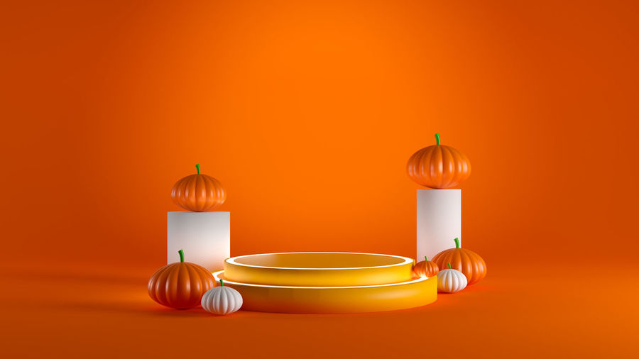 Close-up of orange candle on table