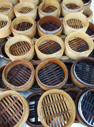 High angle view of bamboo steamer at market stall