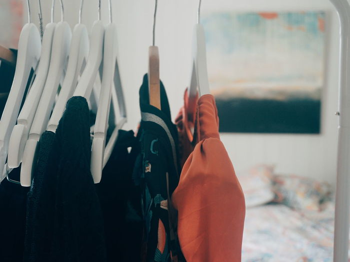 Close-up of clothes on coathanger at home