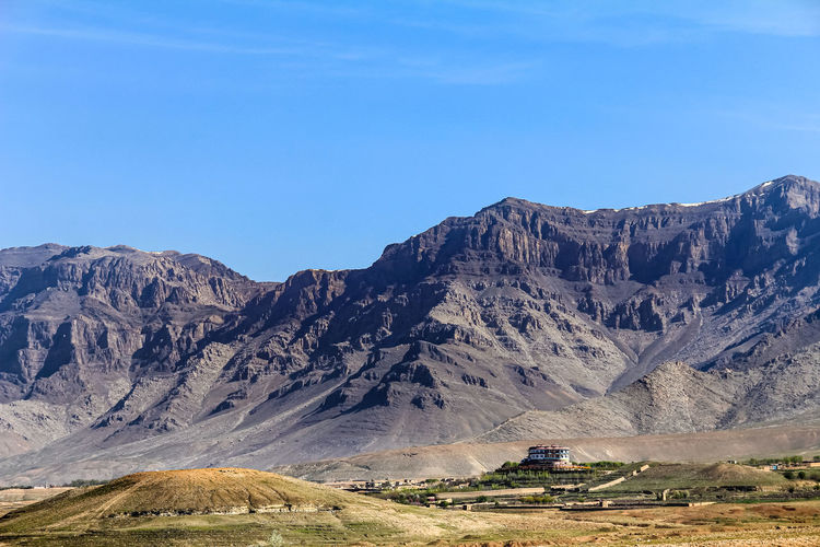 A large house and a mountain in the background. a large house near kabul, afghanistan. detached. 