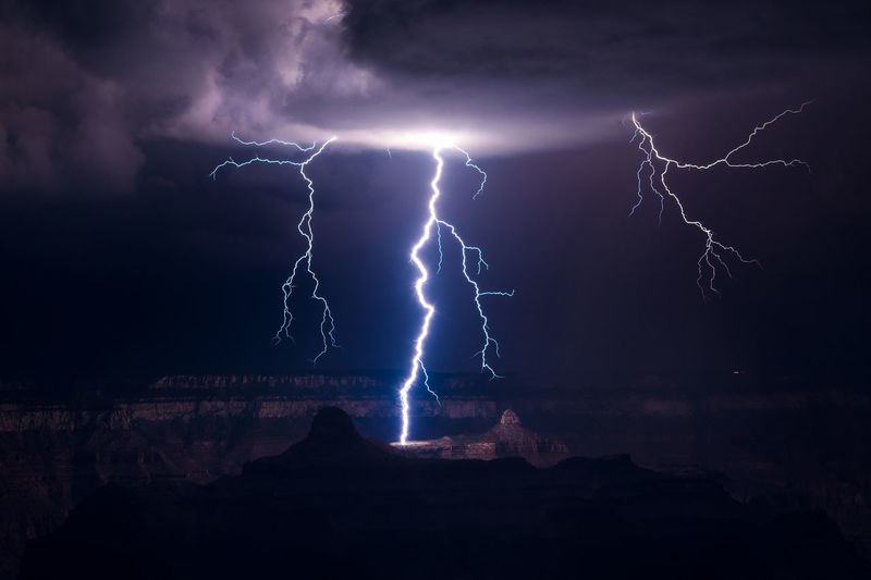 Lightning strikes in the grand canyon as a storm drifts through grand canyon national park, arizona.