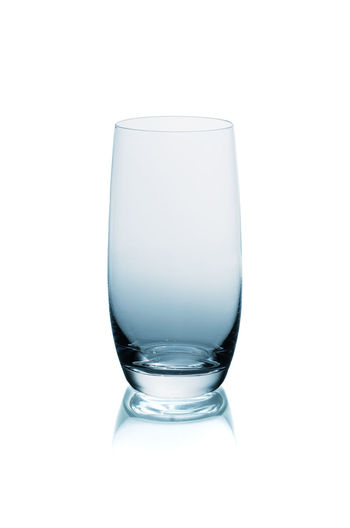 Close-up of drink in glass against white background