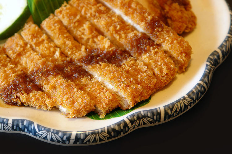 Close-up of fried pork cutlet served in plate