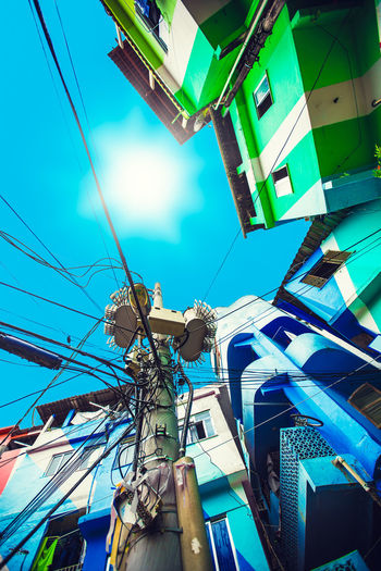 Low angle view of buildings against clear blue sky