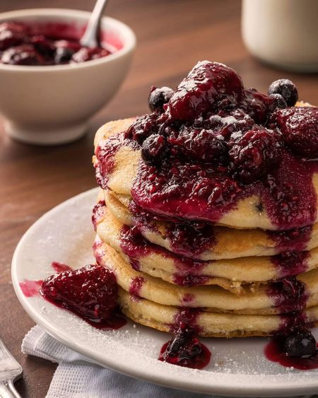 Close-up of pancakes in plate on table