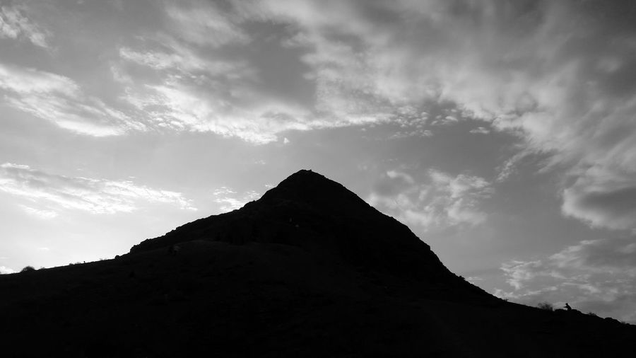 Low angle view of silhouette mountain against sky