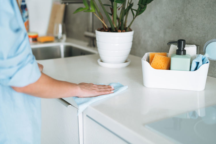 Midsection of man washing hands