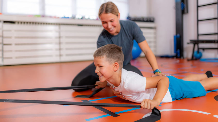 Back exercise for children, using resistance bands
