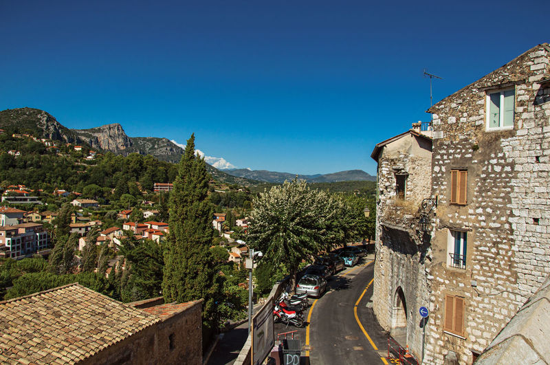 Panoramic view of hills and buildings outside vence, in the french provence.