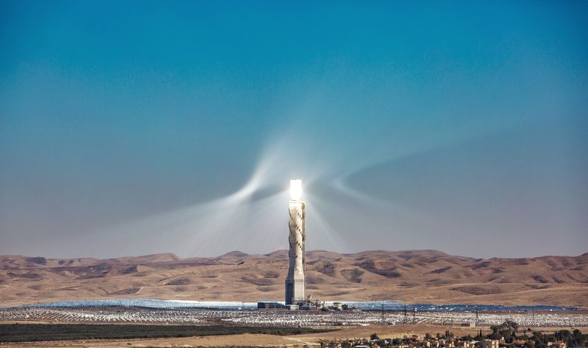 Solar tower in the middle of a solar field 