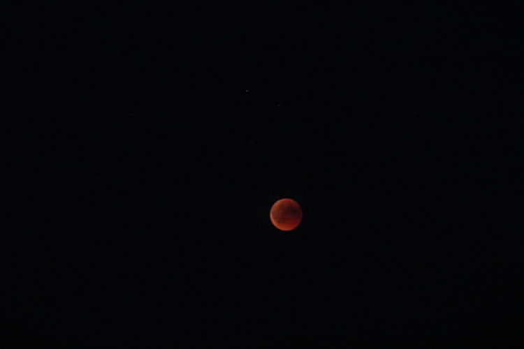 Scenic view of moon against sky at night