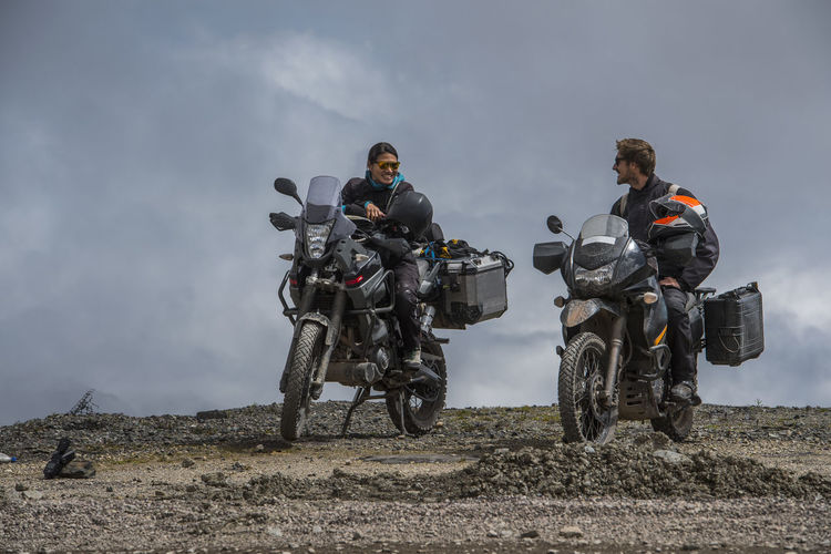 Couple on touring motorbikes at the pass of abra de malaga (4316 m)