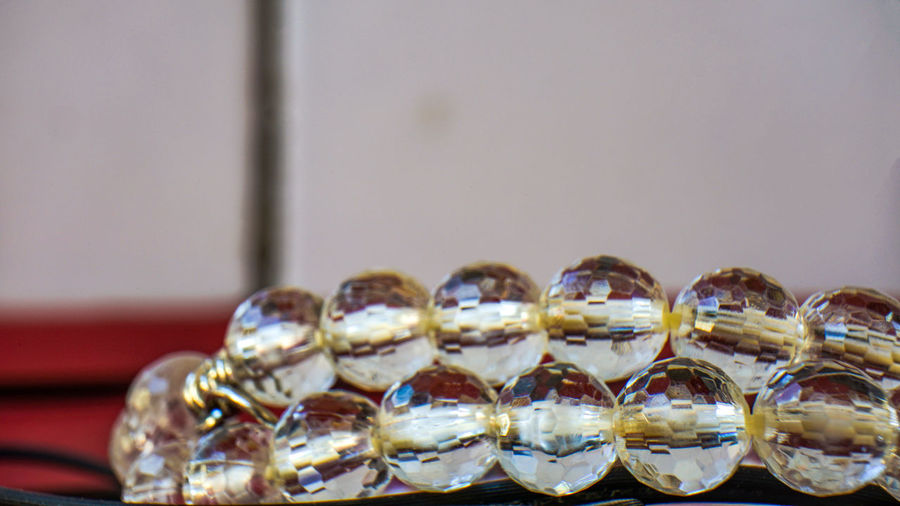 Close-up of bead on table