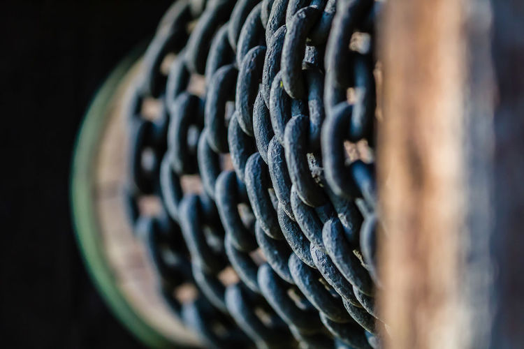 Close-up of chain rolled on spool