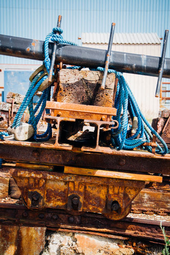 Rope tied on rusty metals and wood at shunting yard