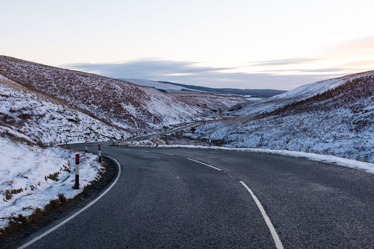 Scenic view of mountains against sky during winter