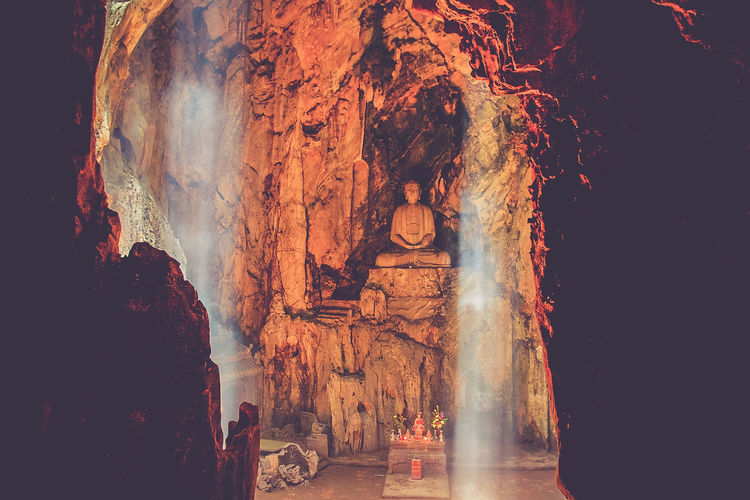 Buddha statue in cave