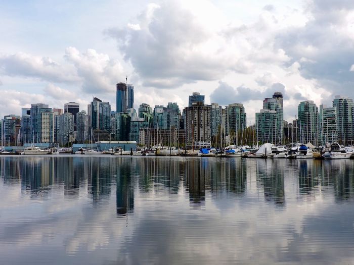 Cityscape against cloudy sky