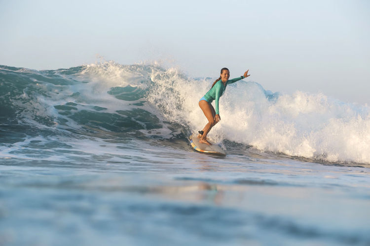 Female surfer on the wave