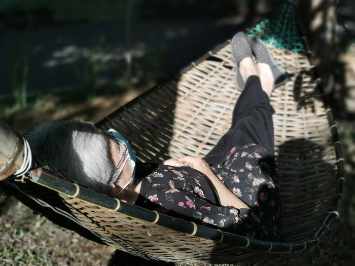 High angle view of woman lying down outdoors