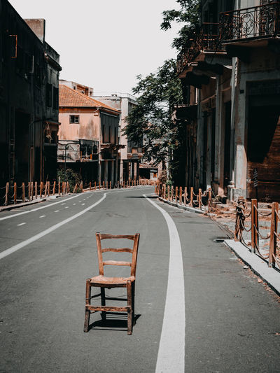 Empty chairs on street