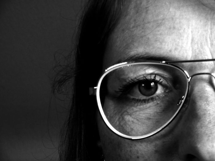 Close-up portrait of woman wearing eyeglasses