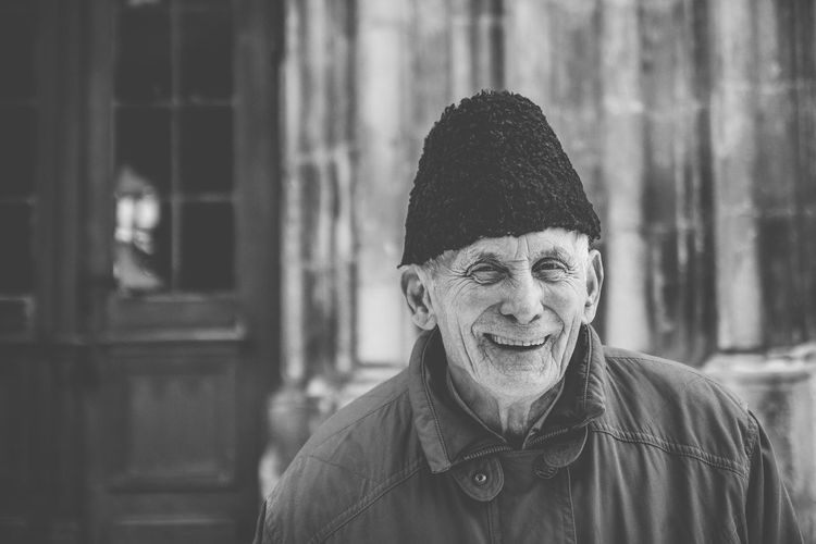 Portrait of smiling senior man outdoors
