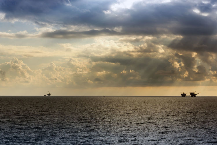 Seascape of sunset at offshore oil field