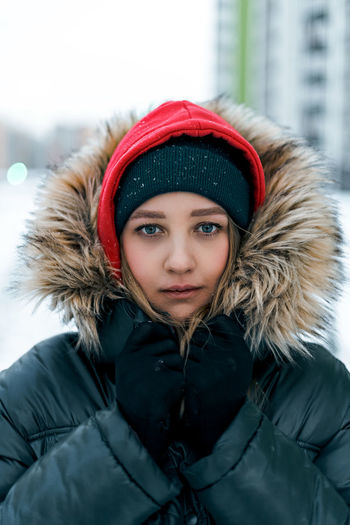 Portrait of young woman wearing fut hat