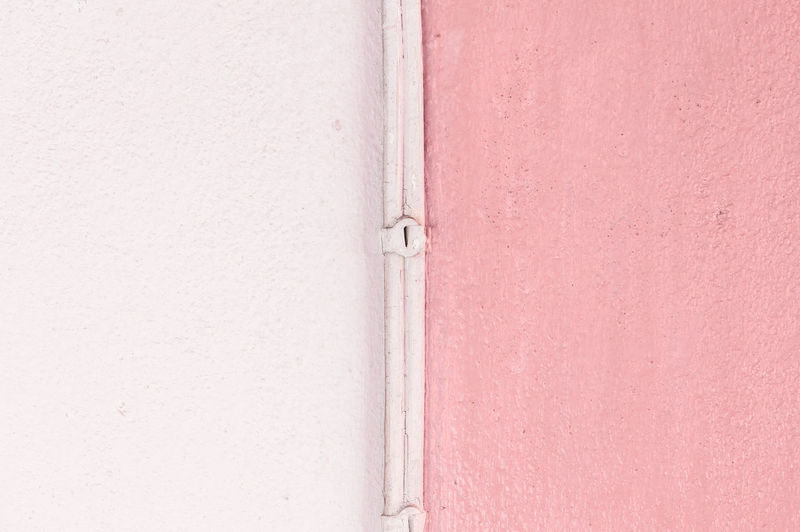 The core is between two color light pink and pink wall background. two side of wall.
