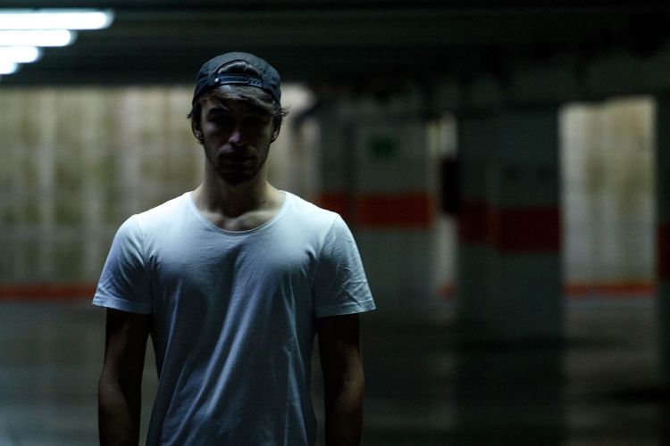 Young man standing in city