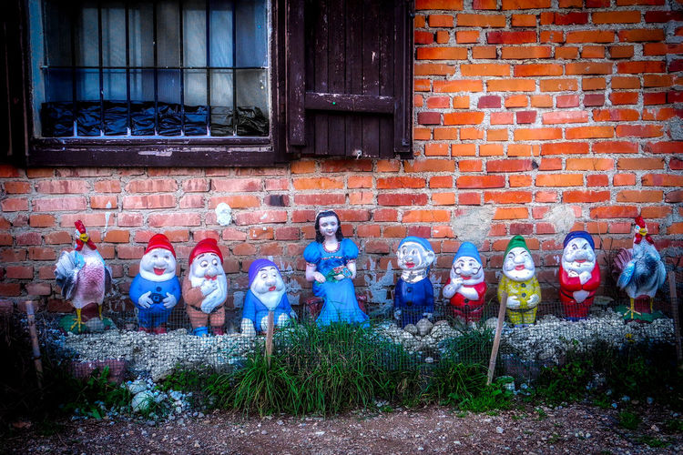 Colorful figurines in yard