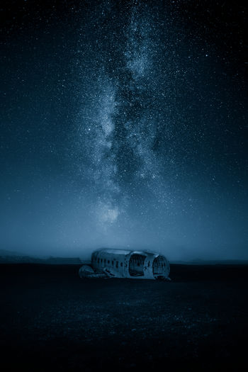 Plane wreck against milky way