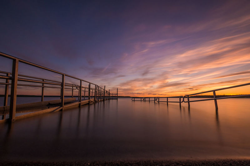 Pier over sea at dusk
