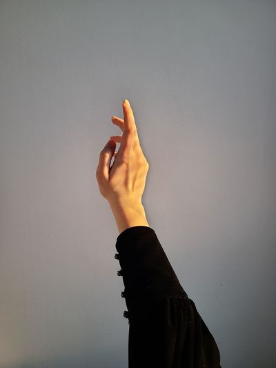 Midsection of woman against wall