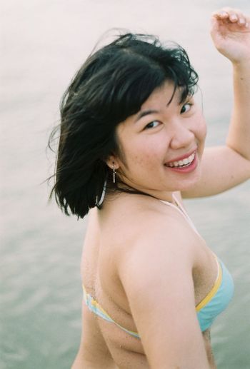Portrait of young woman in bikini
