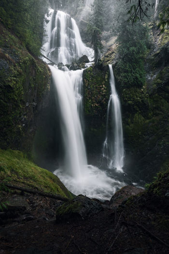 Dramatic vertical of two tiered waterfall in washington