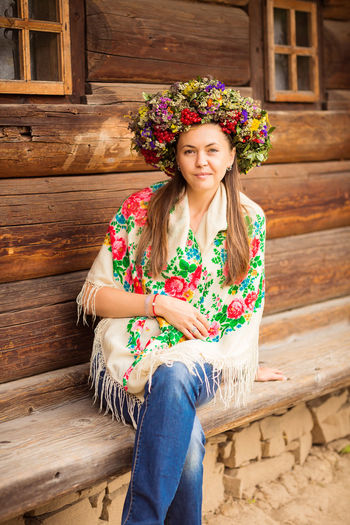 Young pretty ukrainian woman with a wreath of dry herbs on her head