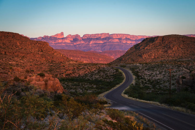 Road by mountain against clear sky in big bend national park - texas