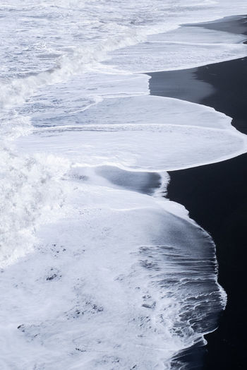 SCENIC VIEW OF FROZEN SEA SHORE