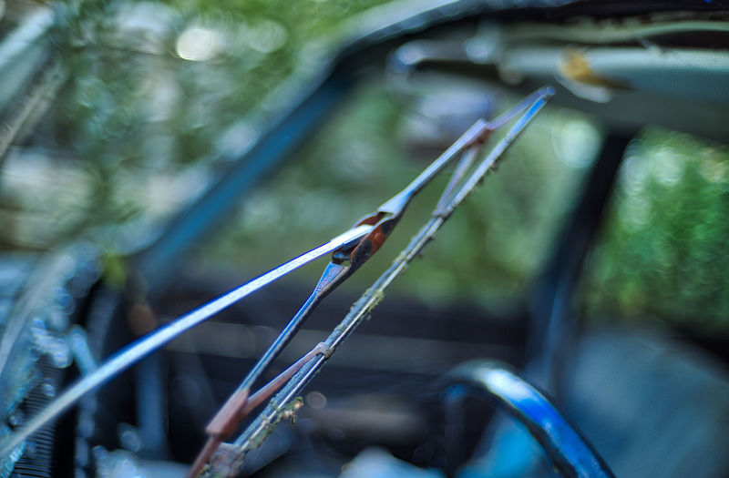 Close-up of windshield wiper on abandoned car