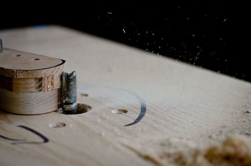 Close-up of shaping a guitar