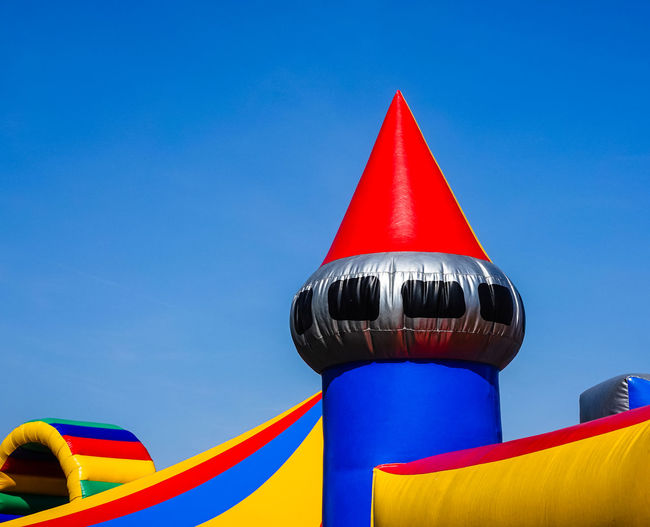 Colourful upper part of a bouncy castle for children at a street festival