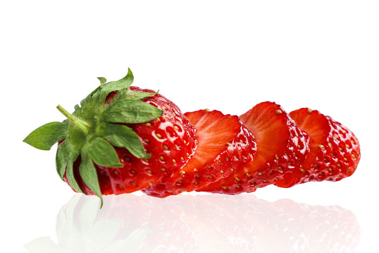 Close-up of strawberry over white background