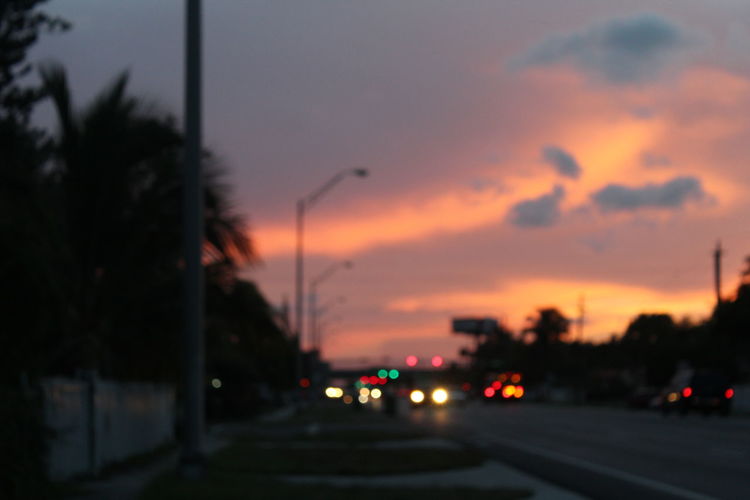 Road against cloudy sky at dusk