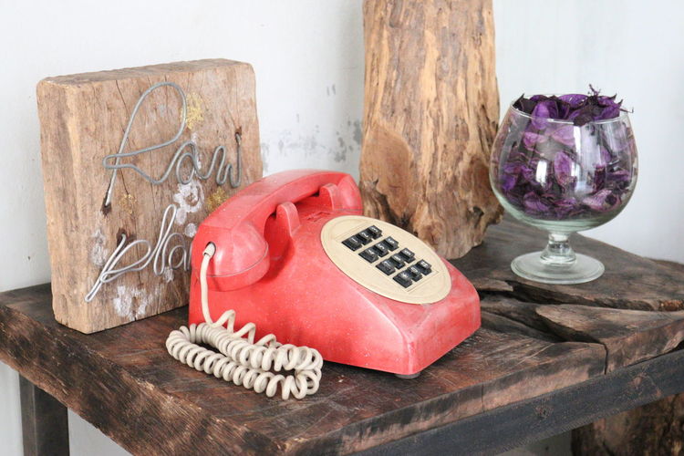 Close-up of telephone on table at home