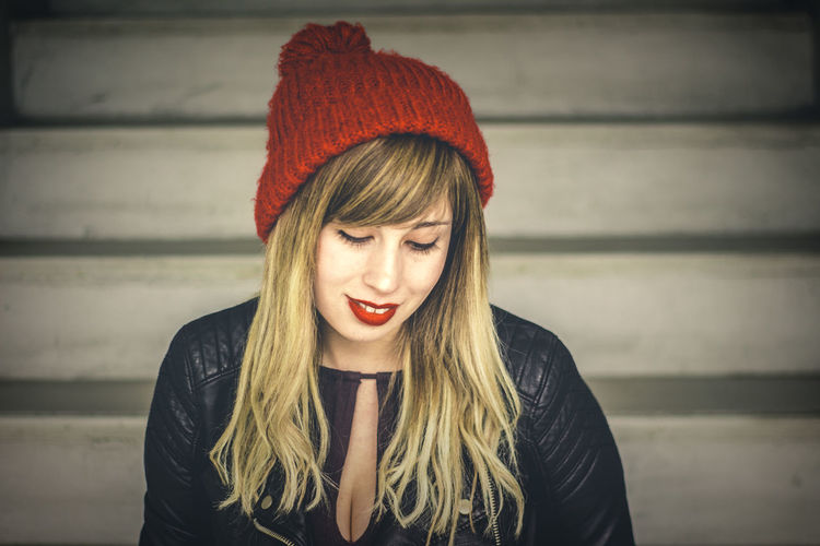 Close-up of thoughtful young woman sitting on steps